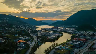 an aerial view of a town next to a river at Førde Hotel - Unike Hoteller in Førde