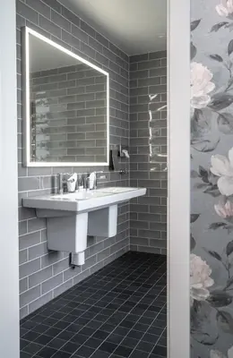 a bathroom with a sink and a mirror at Thon Hotel Sandven in Norheimsund