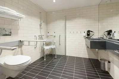 a bathroom with a toilet and a sink at Thon Hotel Elgstua in Elverum