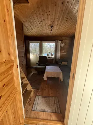 a hallway of a tiny house with a table at Bua in Viksdalen