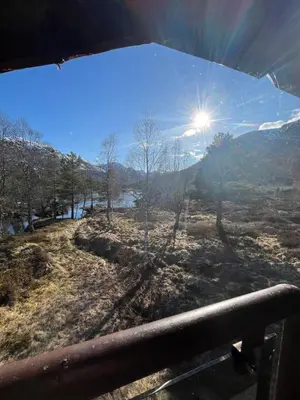 a view from the window of a vehicle with the sun at Bua in Viksdalen