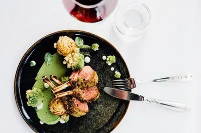 a plate of food with pasta and broccoli on a table at Utne Hotel in Utne