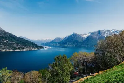 a view of a lake with mountains in the background at Utne Hotel in Utne
