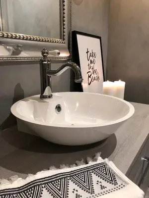 a white sink on a counter in a bathroom at Storehorn Apartments in Hemsedal
