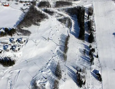 an aerial view of a snow covered parking lot at Alpin Apartments Solsiden in Hafjell