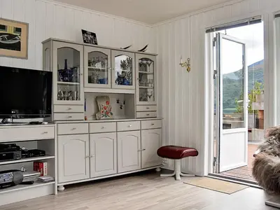 a living room with a large white hutch at 8 person holiday home in EIDSVÅG-By Traum in Mittet