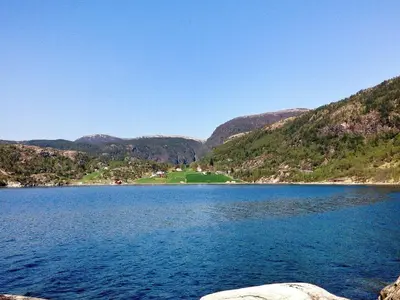 a large body of water with mountains in the background at 8 person holiday home in Masfjordnes-By Traum in Masfjorden