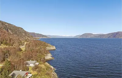 a view of a large body of water with mountains at 3 Bedroom Cozy Home In Lavik in Lavik