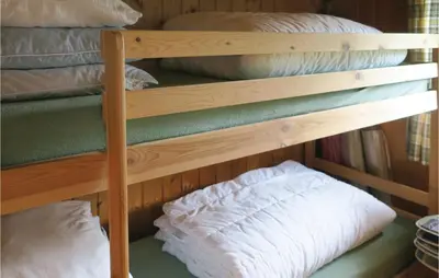 a couple of bunk beds with pillows on them at Stunning Home In Olden With Kitchen in Olden