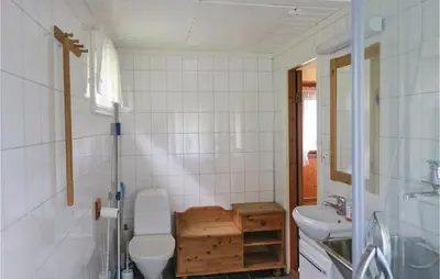 a bathroom with a toilet and a sink at Stunning Home In Olden With Kitchen in Olden