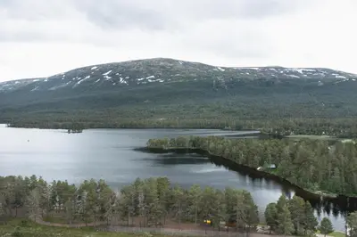 an aerial view of a lake in front of a mountain at Lesjaskogsvatnet Camping in Lesjaskog