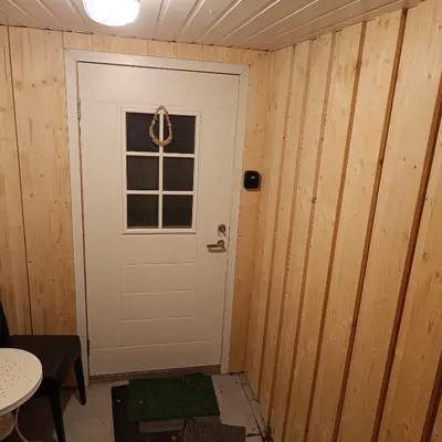 a white door in a room with a window at Malvik, Hundhamaren, Trondheim in Malvik