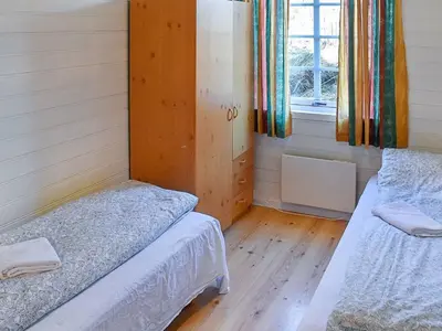 a room with two beds and a window in it at 6 person holiday home in Aukra in Aukra