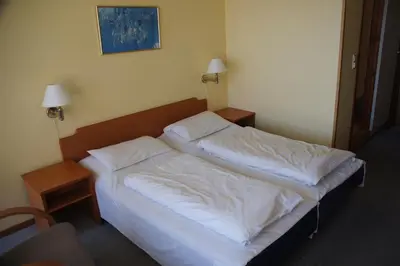a bedroom with two beds in a room at Midtnes Hotel in Balestrand
