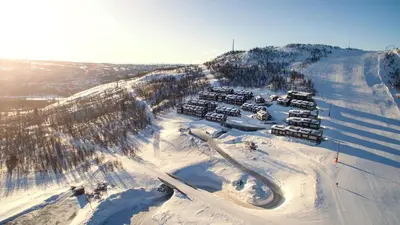 a group of cars parked on a snow covered mountain at Havsdalsgrenda Geilo Apartments in Geilo