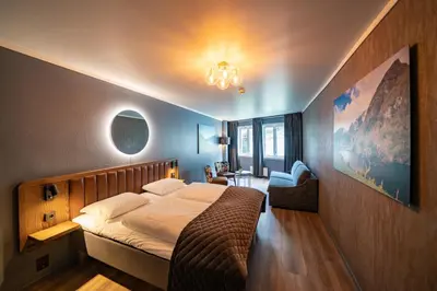 a bedroom with a large bed in a room at Hotel Aurlandsfjord in Aurland