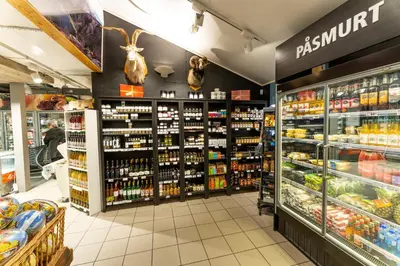 a supermarket aisle with products on display at Åkrafjordtunet Apartments in Teigland
