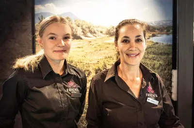 two women are standing next to each other at Frich's Hotell og Spiseri Alvdal in Alvdal