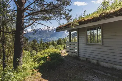 a house with a view of a mountain at Jølsterlia Hyttetun in Årdal