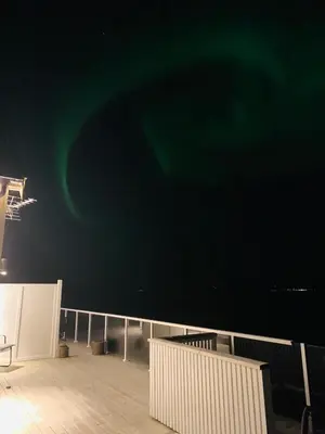 a deck of a ship with a green sky at Seaside Rentals in Trondheim