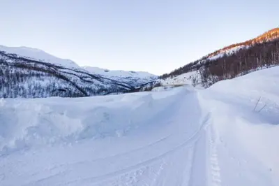 a pile of snow on the side of a road at Maristova apartment 109 in Filefjell