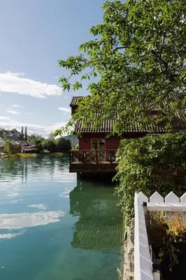 a house on a dock on the water at Stryn - house by the river in Stryn