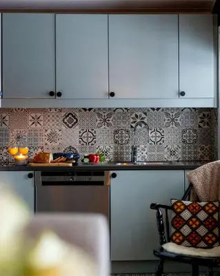 a kitchen with blue cabinets and a counter top at Vollsnes Feriehus in Hjelle