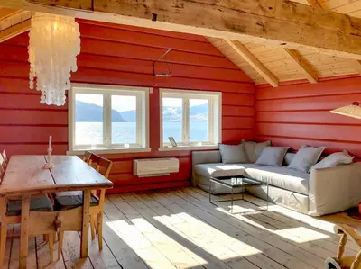 a living room with a couch and a table at Bodvarstova in Stryn