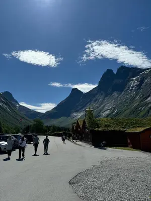a group of people riding skateboards down a road at Trollstigen Camping and Gjestegård in Åndalsnes
