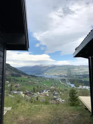a view of a town and a lake from a house at Voss Hytte/Cabin in Skulestadmo