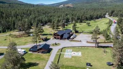 an aerial view of a lodge in the mountains at Jotunheimen Feriesenter in Heidal