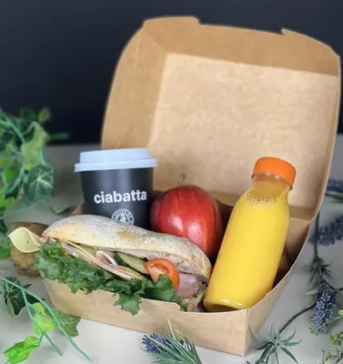 a sandwich and a bottle of juice and an apple at P-Hotels Brattøra in Trondheim