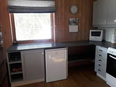 a kitchen with a counter top and a microwave at Hogstul Hytter - Knatten - 3 Bedroom Cottage in Tuddal