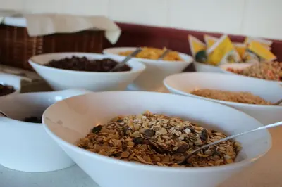 a bowl of granola sitting on top of a table at Nordseter Apartments in Lillehammer