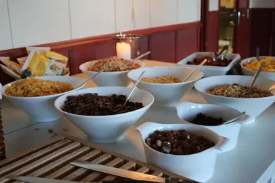a group of bowls of food on a table at Nordseter Apartments in Lillehammer