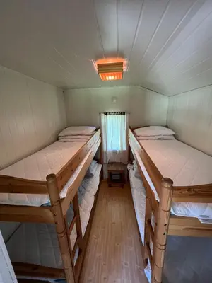 a room with two bunk beds in it at Vistdal Camping in Myklebostad