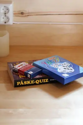 a stack of books sitting on a table at Camp Dronningkrona in Ålvundeid