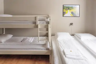 two bunk beds in a small room with at Austbø Hotell in Rauland