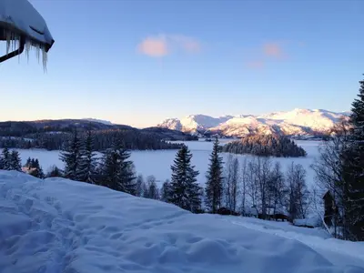 a snow covered hill with mountains in the distance at Totakbu in Rauland
