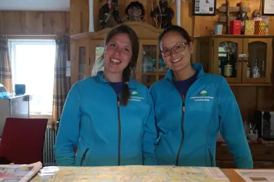 two women standing next to each other at a table at Nordseter Hytter in Nordseter