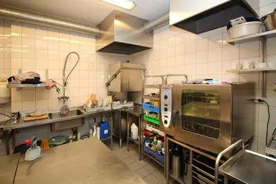 a kitchen with a large kitchen with a large appliance at Sentrum Hotel in Nordfjordeid