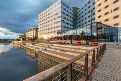 a group of buildings next to a body of water at Clarion Hotel Trondheim in Trondheim