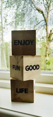a stack of boxes with the words enjoy fun and good life at Fjellhagen in Bjørkheim