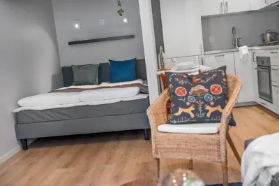 a living room with a couch and a chair at NG Apartments in Bergen