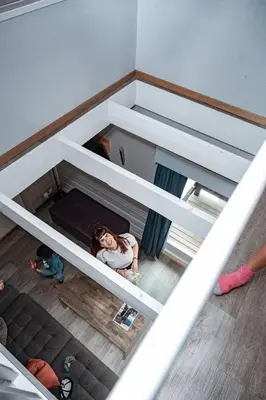 a woman is standing inside of a bunk bed at Hemsedal Cafe Skiers Lodge in Hemsedal