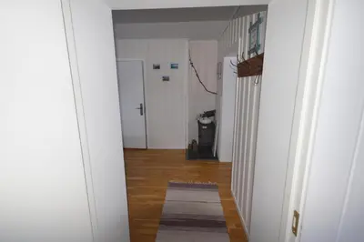 a hallway of a room with a rug on the floor at Apartment between Ustaoset and Geilo in Geilo