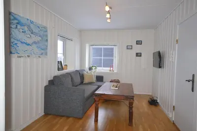 a living room with a couch and a coffee table at Apartment between Ustaoset and Geilo in Geilo