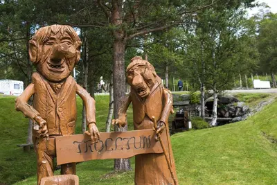 a statue of two people holding a sign at Dombås Hostel in Dombås