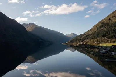a view of a lake between two mountains at Fjærland Fjordstove Hotell - Huseby Hotelldrift AS in Fjarland