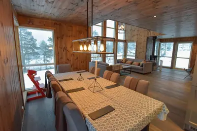 a dining room with a table and chairs in a cabin at Trysilsetra 40 in Trysil